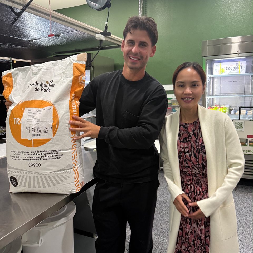 Chef Sang with the flour company representative and a bag of Tradition T65